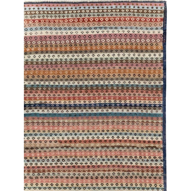 This mid-20th-century Turkish Anatolian wide gallery runner presents a finely striped composition built from closely...