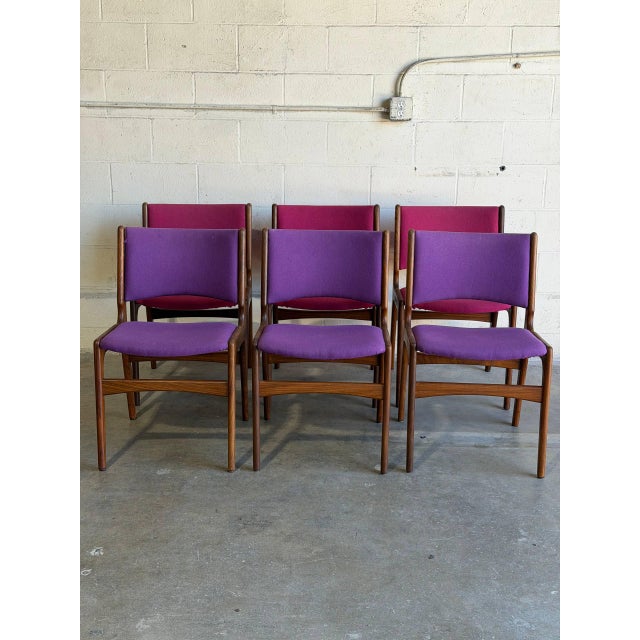 These organic dining chairs showcase curved floating seat pads and contoured backrests crafted from warm solid rosewood...