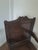 A handsome English oak wainscot armchair, probably late 17th century, with a particularly attractive carved and shaped...