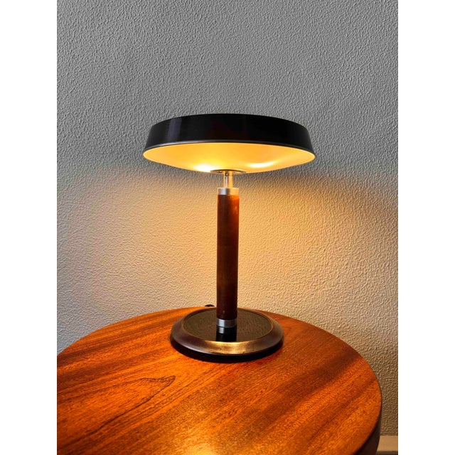 The Model Grecia Table Lamp, designed by Luis Perez de la Oliva for Fase in 1967, is an elegant example of Spanish mid-...