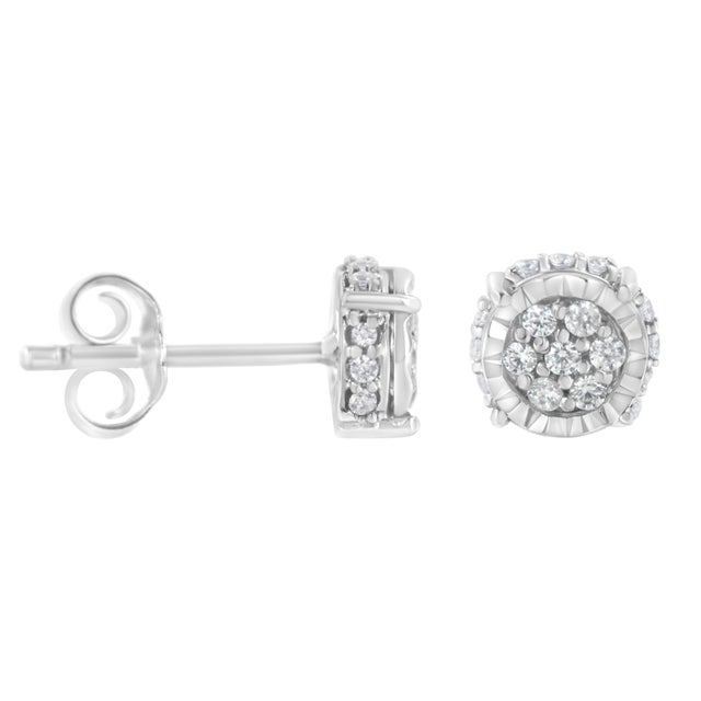 These delicate stud earrings have a unique design. Crafted in sterling silver, these earrings showcase 1/3ct TDW of promo...