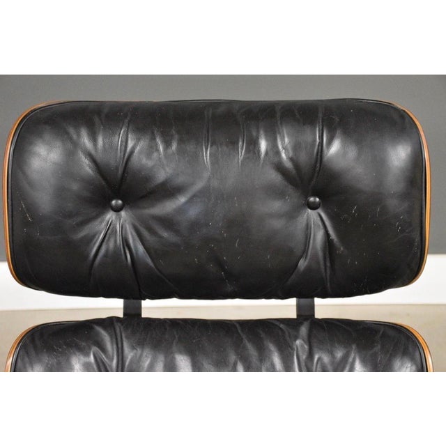Wood Charles and Ray Eames Herman Miller Rosewood Lounge Chair and Ottoman For Sale - Image 7 of 12