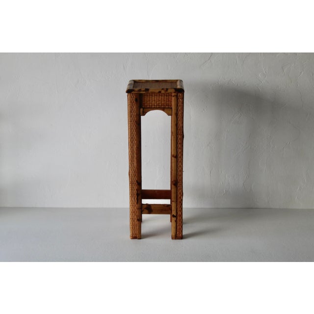 A vintage bohemian-style plant stand made of bamboo, rattan, and plywood, mid-century modern. Beautifully crafted. Smaller...