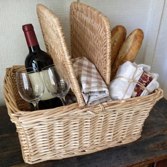 This charming rattan / wicker picnic basket is generous in size. It features a sturdy woven construction, perfect for...