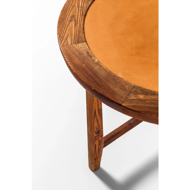 Rare side table in the manner of Axel Einar Hjorth. Produced in Sweden.