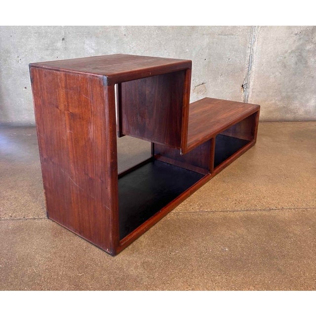Uniquely shaped case good. Would work great in an entryway or mudroom. Solid walnut piece can also be a bench with a...