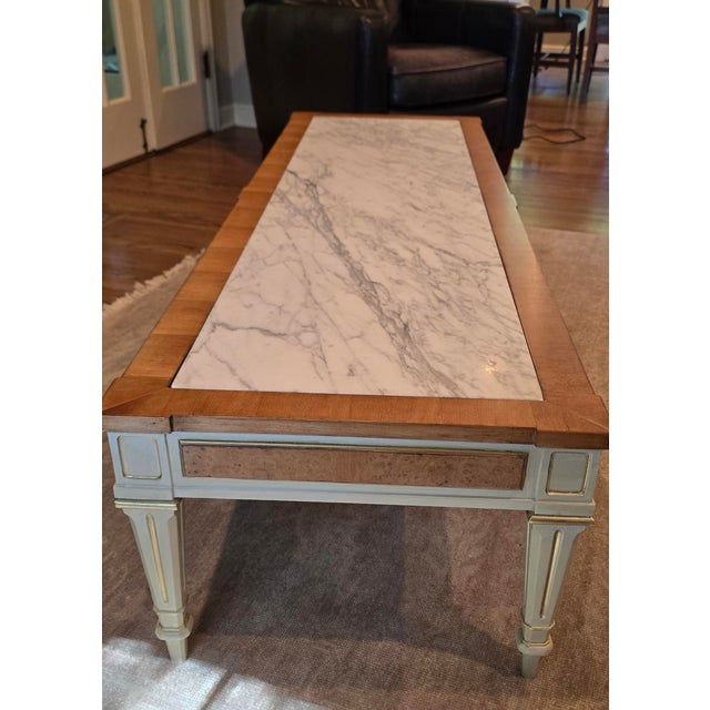 This Weiman coffee table features an authentic Italian marble top sourced from Capi, Italy. The marble has natural gray...