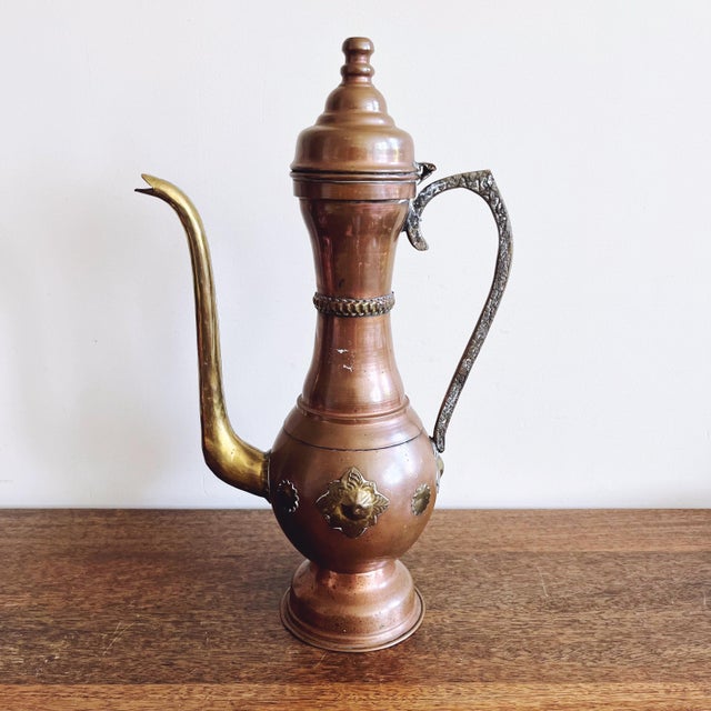 Vintage Moroccan brass and copper dallah. Beautiful detail and intricate craftsmanship, marked “Morocco” on the base....