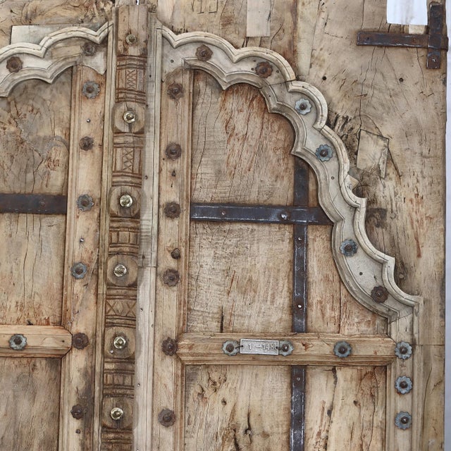 This Antique Indian Carved Teakwood Door, c. 1880–1900, was once the entry to a residence in Rajasthan, where richly...
