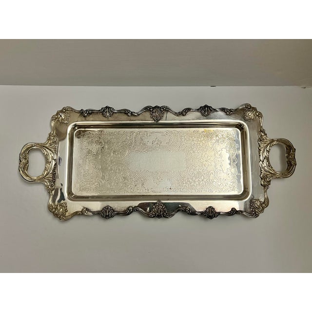 Elevate your entertaining or home decor with this magnificent large vintage silverplated serving tray by the renowned W. &...