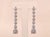 The Santa Rosa Outstanding Antique Platinum Dangler Earrings. The earrings feature a large old European cut center diamond...