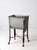 An early 20th-century metal wash stand featuring a galvanized tub with its original spigot, all set within a slender metal...