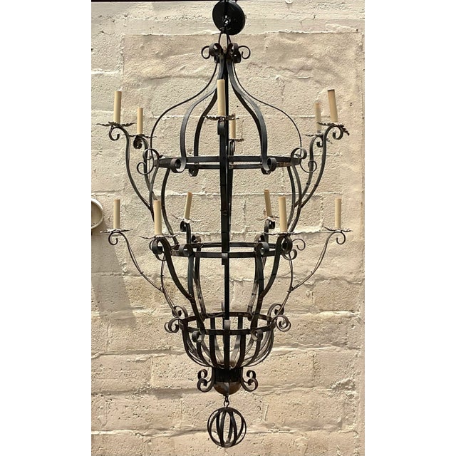 Transform your space with our Vintage Boho Monumental Wrought Iron Chandelier. This stunning fixture boasts intricate...