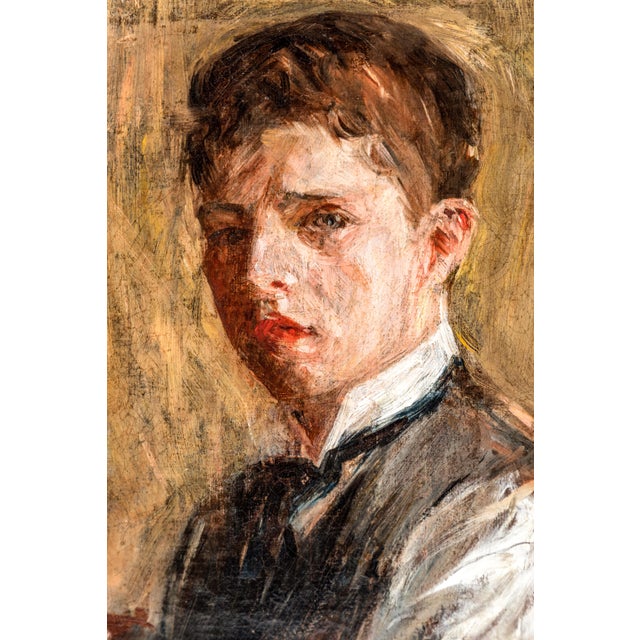 Deftly painted, oil on canvas picture of a young man in three-quarter profile. Held in a hand carved, period frame. Signed...