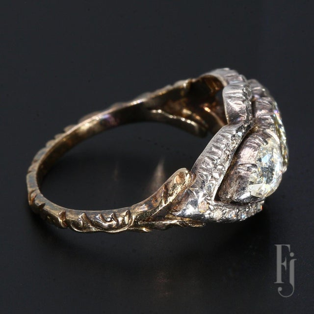 Here is an Antique 14k White & Yellow Gold Three Stone Diamond Ring. The Central Oval Rose-Cut Diamond & The Two Pear-...