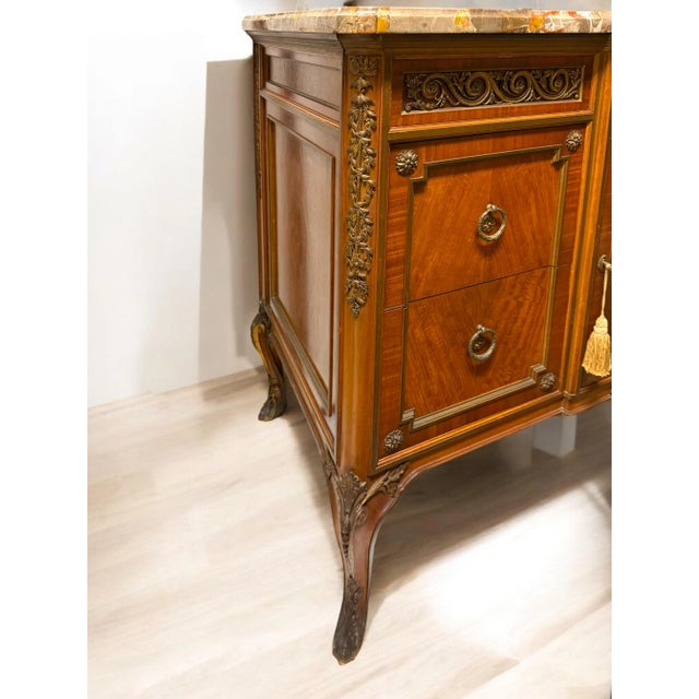 A magnificent 19th-century gilt Bronze mounted marquetry commode, signed Henry Dasson, 1883, showcasing the unparalleled...