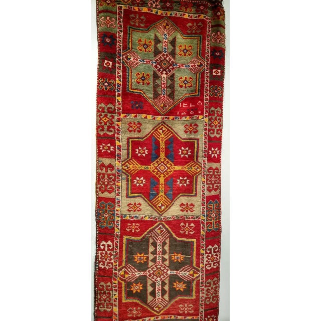 Beautiful and colorful Early 20th Century Vintage Turkish Oushak Runner, meticulously hand-knotted in the early 1900s....