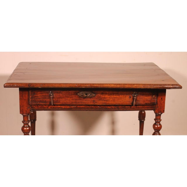 lovely 17th century oak table in Louis XIII style resting on a very elegant base with turned legs connected by spacers and...