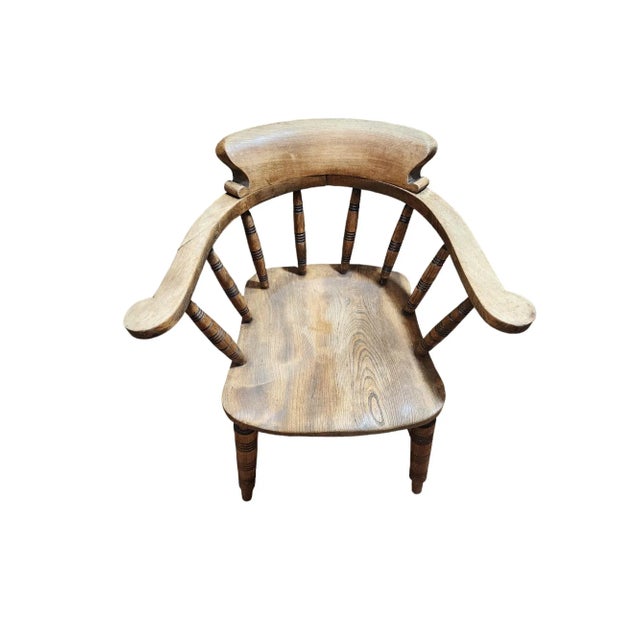 Fantastic English oak and beech smokers bow armchair, made in 1917 by another important furniture maker in High Wycombe,...