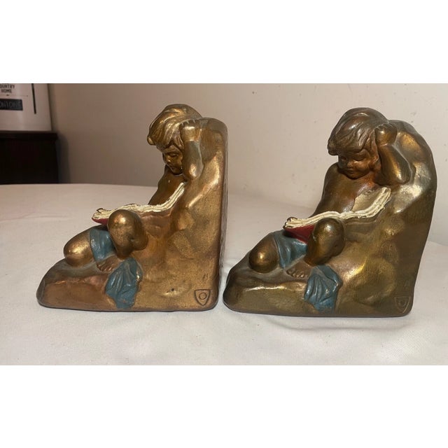 19th Century Large Pair Antique Armor Patinated Bronze Clad Co. Cherub Boy Reading Bookends For Sale - Image 5 of 12