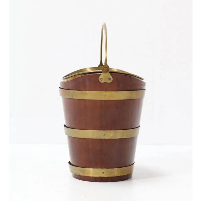 Wonderful Dutch wine cooler. Striking Dutch design from the 19th century. Solid mahogany with original brass bucket. In...