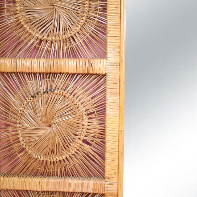 Make a bold statement with this vintage horizontal mirror framed in natural buri rattan. The wide rectangular mirror is...