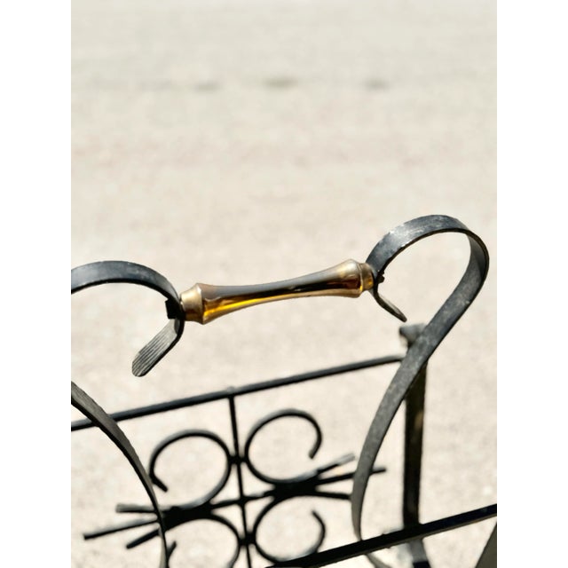 Add a touch of timeless sophistication to your space with this Vintage Mid-Century Wrought Iron Magazine Rack, complete...