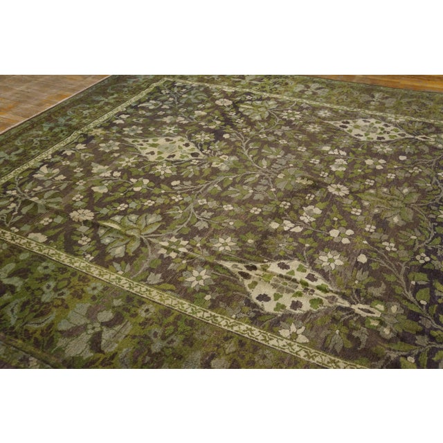 An unusual sienna brown field is partitioned by floral ribbons into giant star panels filled with more, matching floral...