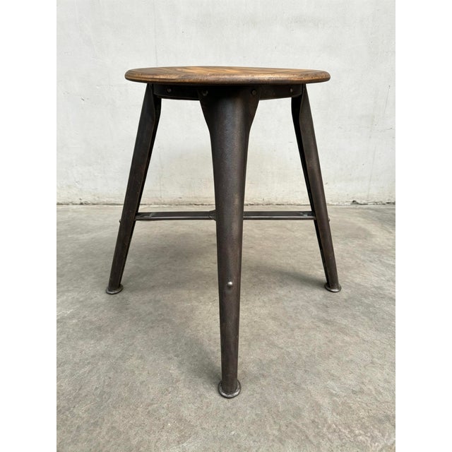 1930s rare 4 legged industrial work stool by Ama Elastik Nordhalben Germany. Steel lacquered frame with a beach wooden...