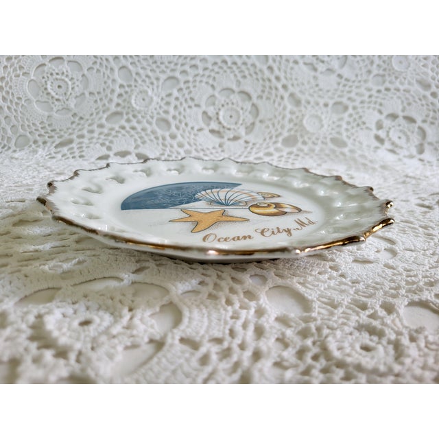 A decorative Ocean City, Maryland souvenir plate ready to hang. It measures 8 ¼” diameter x ½” and is in excellent vintage...