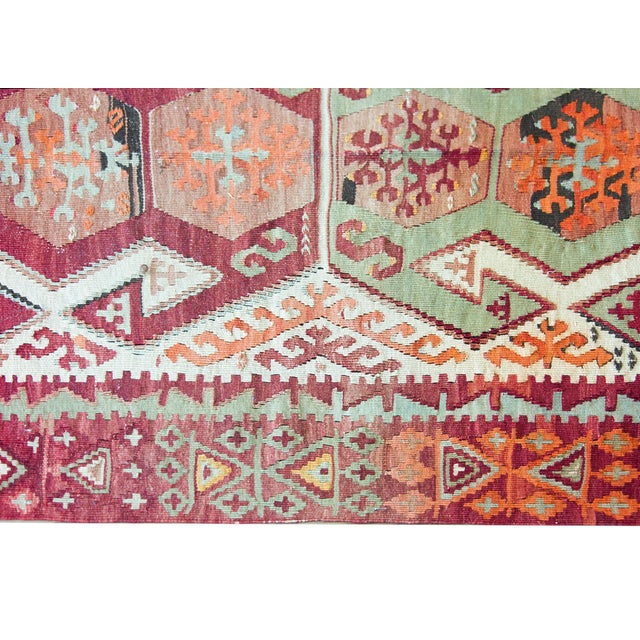An incredible and bold mid-20th century Turkish Konya kilim rug with two large geometric pattered medallion with myriad...