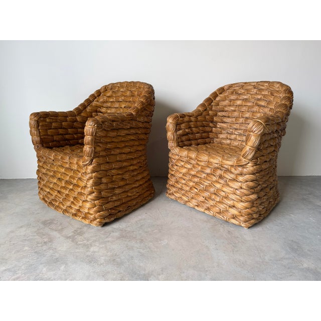 A stunning pair of Ralph Lauren “Joshua Tree” barrel back dining chairs, beautifully crafted in thick handwoven natural...