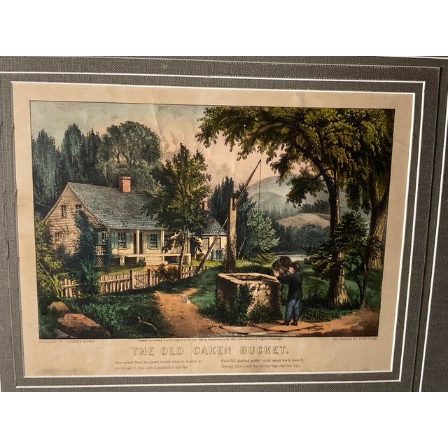 Americana hand-colored lithograph titled "The Old Oaken Bucket," published by the prominent American printmaking firm...