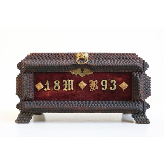 Gorgeous Tramp Art box / Jewelry box marked 1893 and decorated with brass. The box contains multiple guns & pike helmets...
