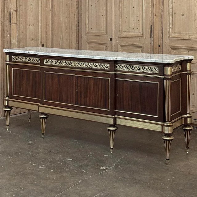 Grand Antique French Louis XVI Mahogany Marble Top Buffet a l'Etrusque will add classic elegance to any room on a large...