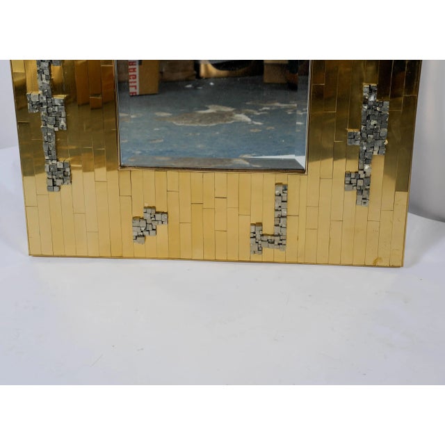 This Brutalist mirror was designed by Georges Mathias.