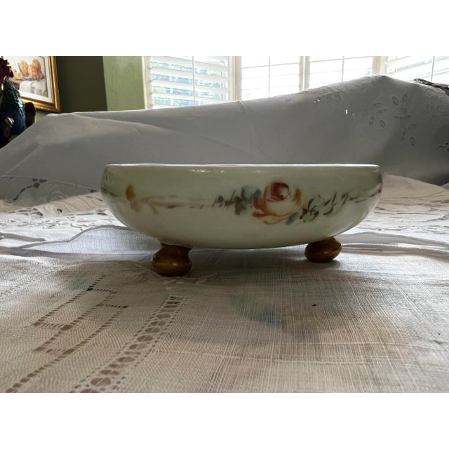 Vintage Royal Bavari Porcelain bowl. Hand painted Roses on. Three footed. Opalescent interior.