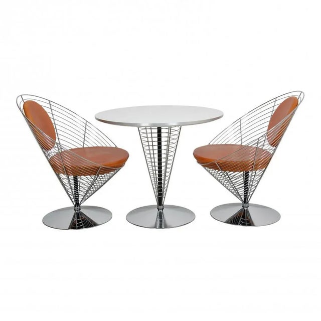 Designer: verner panton manufacturer: fritz hansen model: wire cone chair (2) and table (1) measurements: chair: h: 76, w:...
