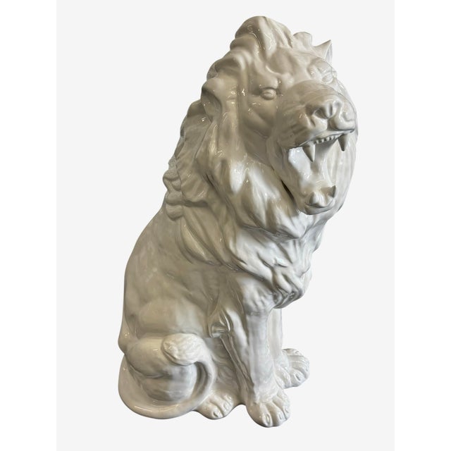 Vintage Blanc de chine ceramic Lion statue. The statue is a large white glazed statue.