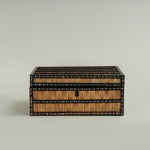 Impressive antique Anglo Indian lidded box handcrafted in porcupine quills and ebony decorated with bone dots. The...