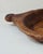 Antique European hand-carved wooden dough bowl or trencher, carved from a single solid piece of wood with integrated...