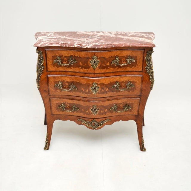 A stunning antique French marble top bombe commode with an amazing original rouge marble top. This was made in France and...