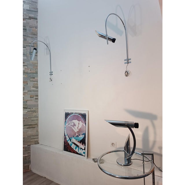 Magnificent pair of Tharsis wall sconces by Luis Perez De La Oliva for Fase. Spain, 1970s. Long, curved arm in chromed...