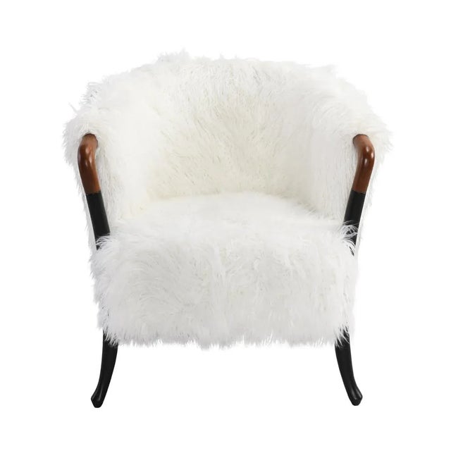 Chic and comfortable white faux fur arm chair with two toned wooden arms and legs. Seat height is 19".