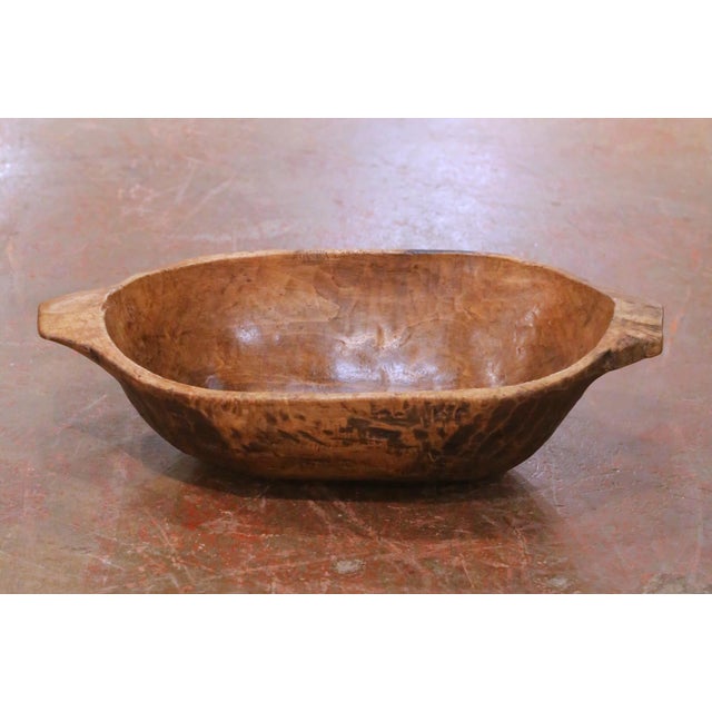 This authentic antique French dough bowl was hand-carved from a single block of hardwood circa 1880 and reflects the...
