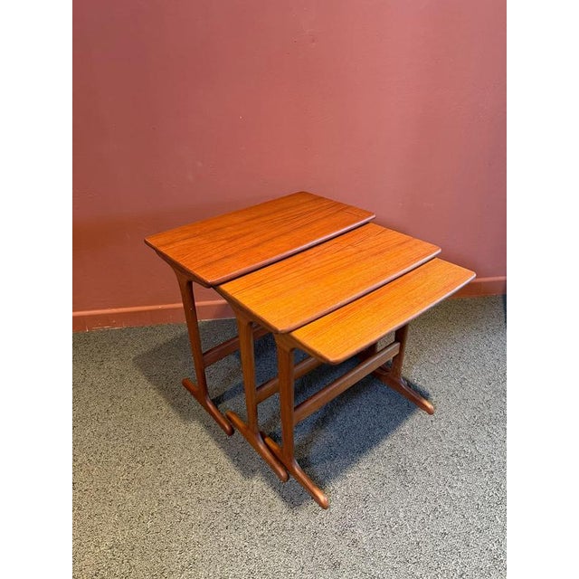 Set of 3 teak nesting tables – danish design 1960s elegant set comprising three nesting tables made of precious teak wood,...