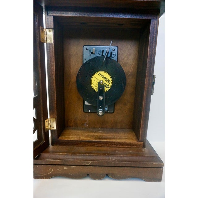 Step into the golden age of Swiss mechanical music with this authentic Thorens AD 30 disc-playing music box. Housed in a...