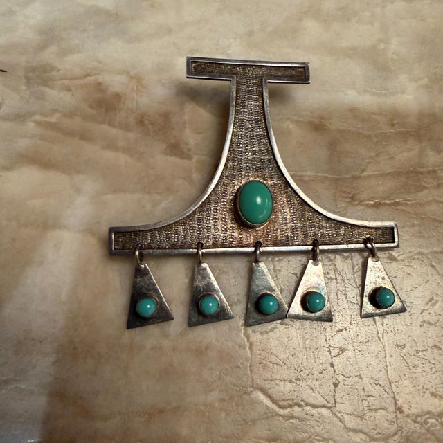 For your consideration, a vintage modernist kinetic pendant or brooch designed by the renowned Ecuadorian artist Oswaldo...