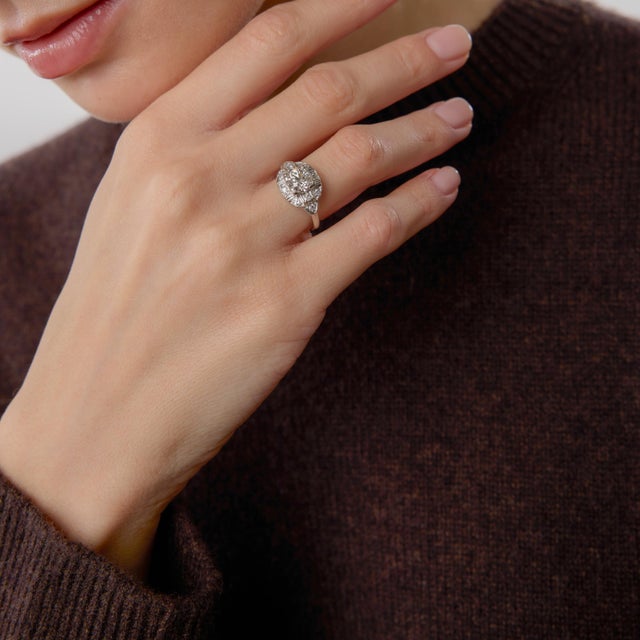 This authentic Art Deco engagement ring is a refined expression of 1930s craftsmanship and enduring elegance. At its...