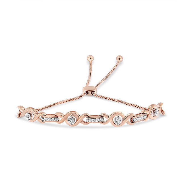 Certain to create a sophisticated look with any attire, this stylish diamond bolo bracelet is composed of 14k rose gold...